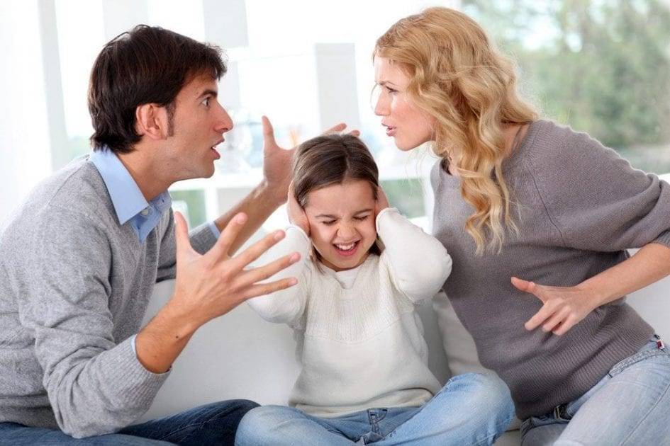 little-girl-at-the-center-covering-her-ears-while-dad-and-mom-arguing