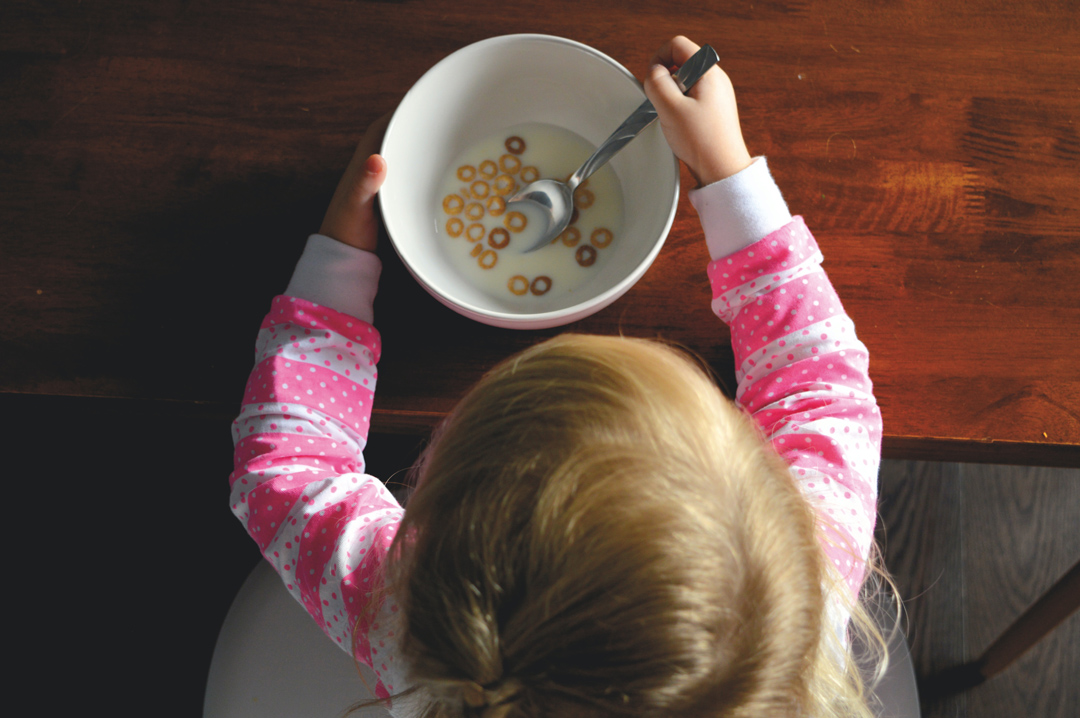 little-girl-eating-her-cereal-morning-breakfast