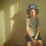 a-boy-sitting-seeking-attention-by-dimmis-vart-at-unsplash