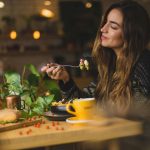 happy-woman-eating-nutritious-food-good-for-the-brain-by-pablo-merchan-montes-at-unsplash
