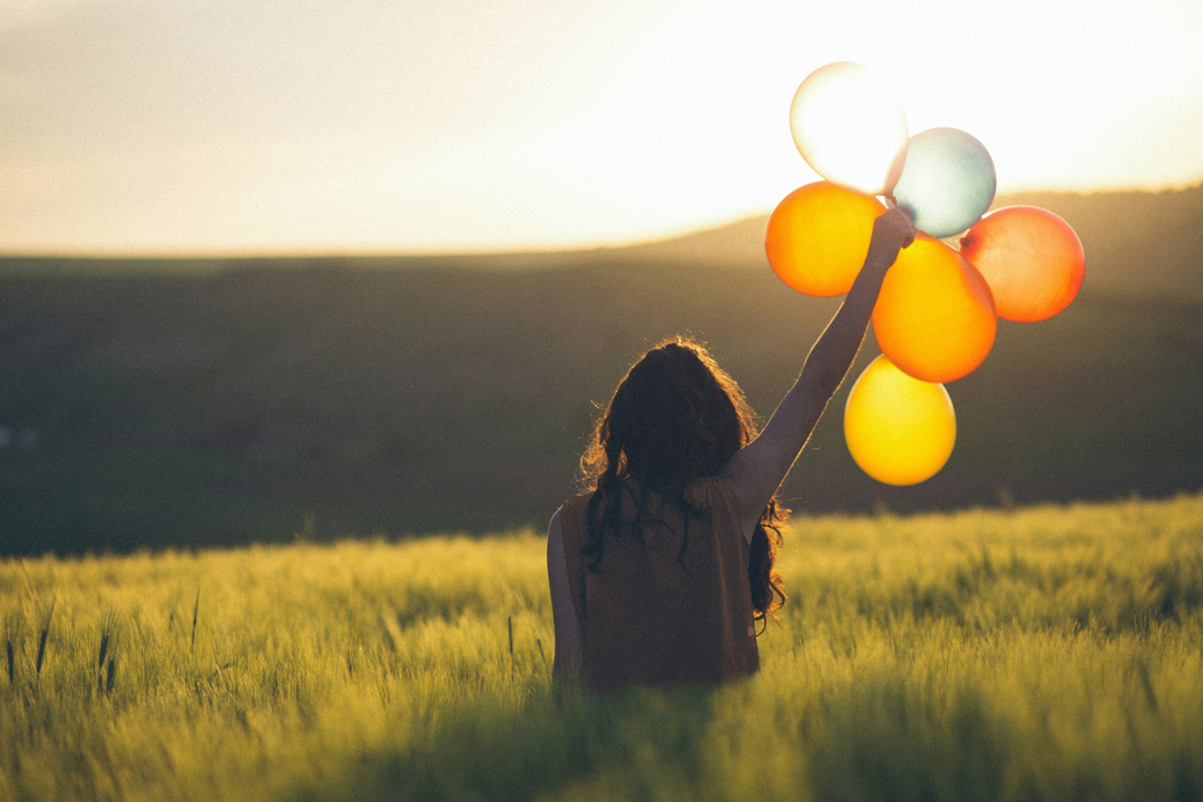 woman-about-to-release-balloons-by-catalin-pop-noyd-at-unsplash