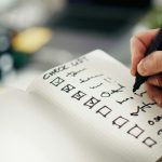 a-person-checking-lists-unsplash