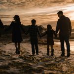 family-walking-at-the-beach-sunset-by-chris-hardy-unsplash