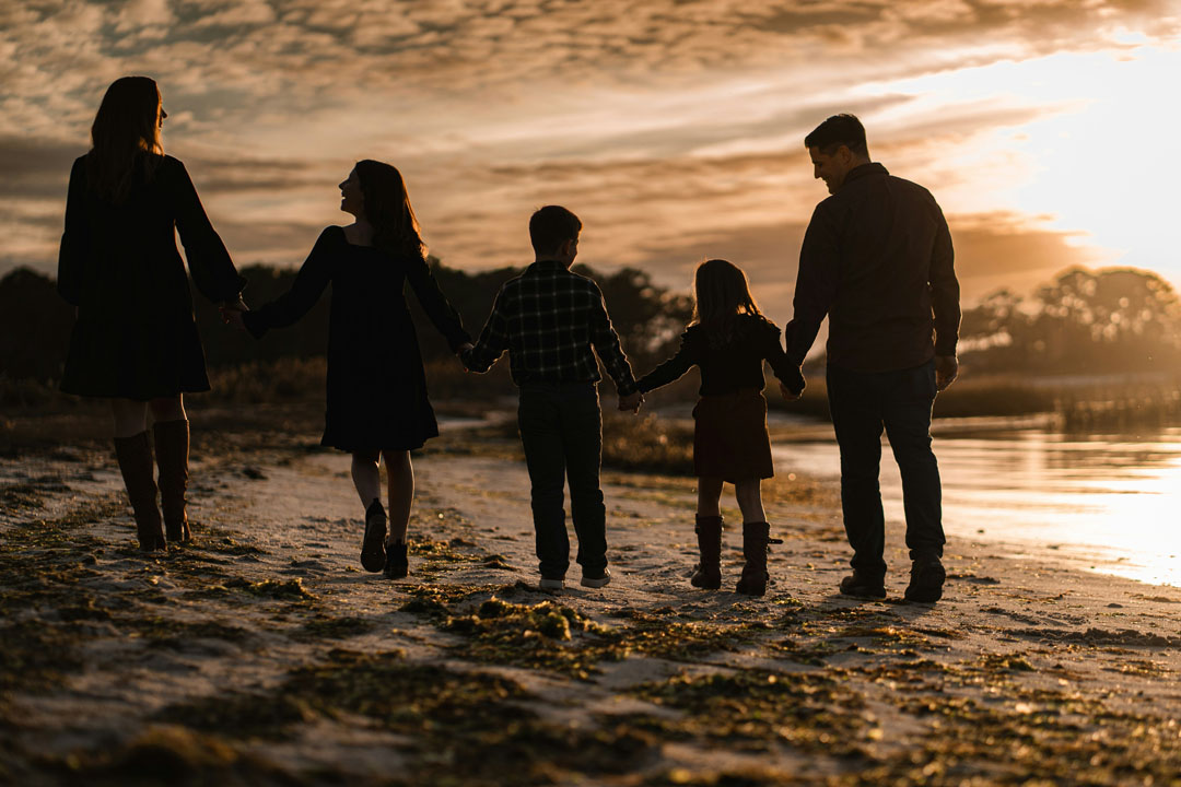family-walking-at-the-beach-sunset-by-chris-hardy-unsplash