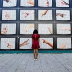 woman-standing-in-front-tv-juno-jo-unsplash