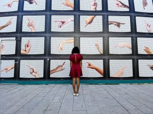 woman-standing-in-front-tv-juno-jo-unsplash