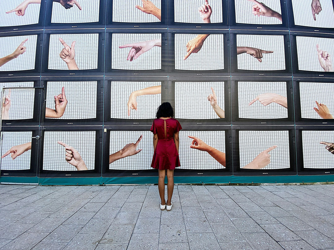 woman-standing-in-front-tv-juno-jo-unsplash